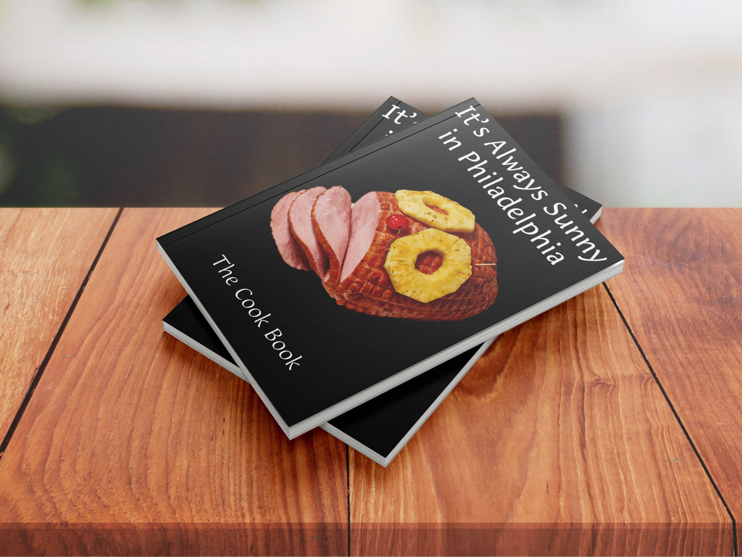 Stack of 'It's Always Sunny in Philadelphia' cookbooks
